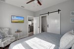 Master bedroom with barn door privacy to bathroom